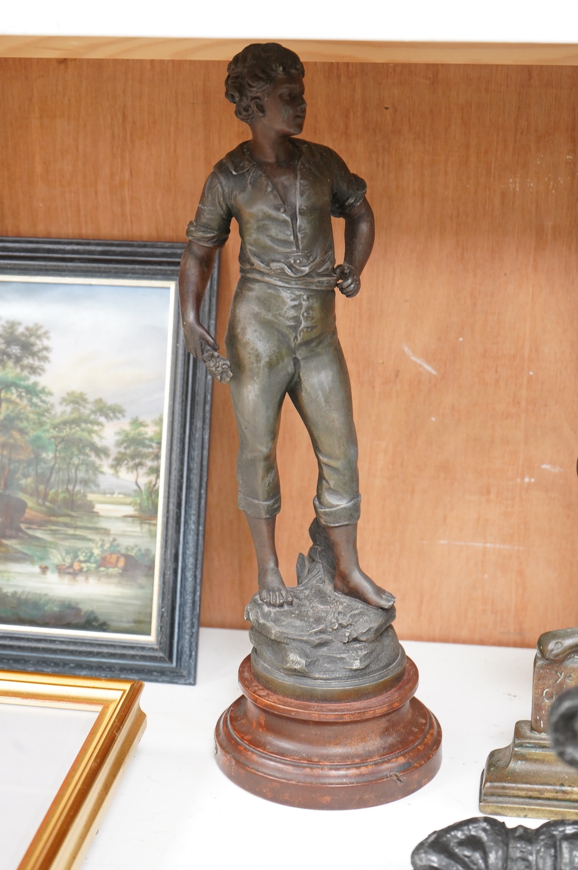 A collection of various metal wares to include door stops, boot scraper, spelter figure etc, largest 49cm high